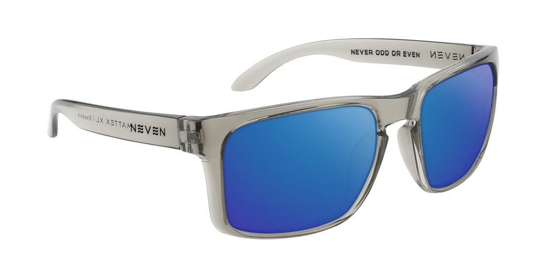 Three quarter view of Breakers XL sunglasses with translucent gray squared frame and blue mirrored lenses on white background