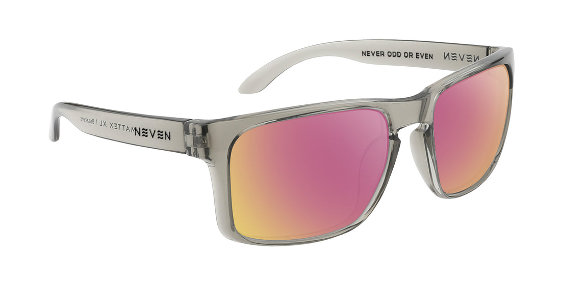 Three quarter view of Breakers XL prescription sunglasses with translucent gray squared frame and rose pink mirrored lenses