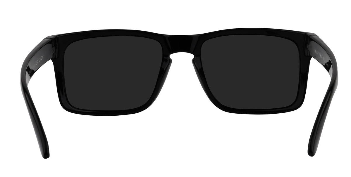 Close-up front view of Doom XL sunglasses showcasing glossy black rectangular frame and black polarized lenses with white background
