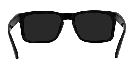 Close-up front view of Doom XL sunglasses showcasing glossy black rectangular frame and black polarized lenses with white background