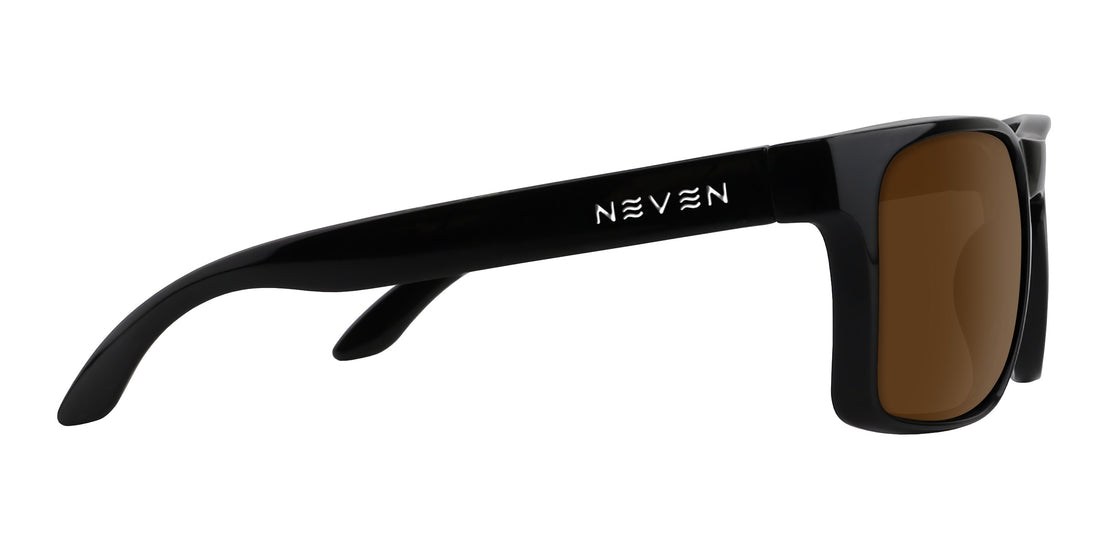 Side view of Doom XL prescription sunglasses showcasing glossy black oversized rectangular frame and brown lens on white background