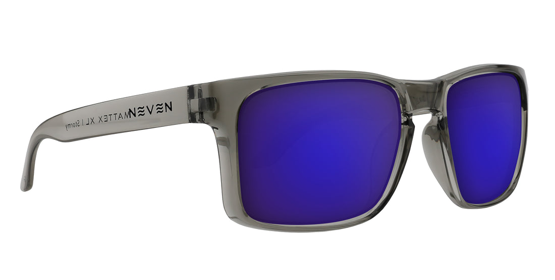 Close-up side view of Stormy XL prescription sunglasses showcasing transparent gray glossy rectangular frame and purple mirrored lenses on white background