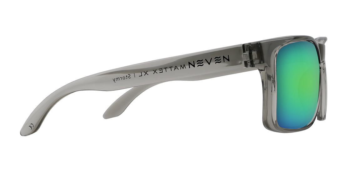 Side view of Stormy XL prescription sunglasses showcasing glossy translucent gray oversized frame and green-blue mirrored lens on white background