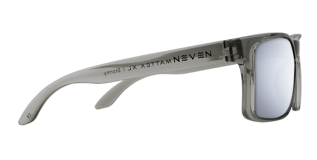 Side view of Stormy XL sunglasses with glossy transparent gray oversized frame, mirrored silver lens, Neven logo, white background