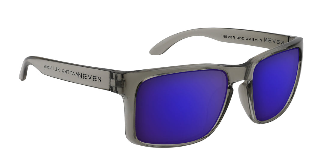 Three-quarter view of Stormy XL prescription sunglasses showing translucent glossy gray oversized frame and purple mirrored lenses