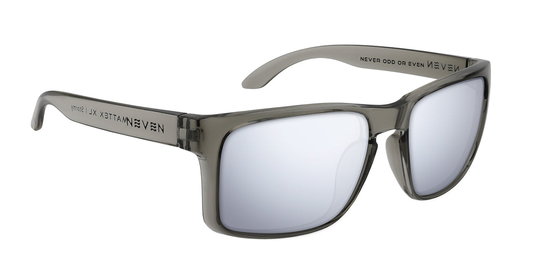 Three-quarter view of Stormy XL prescription sunglasses with glossy translucent gray oversized frame and silver mirrored lenses