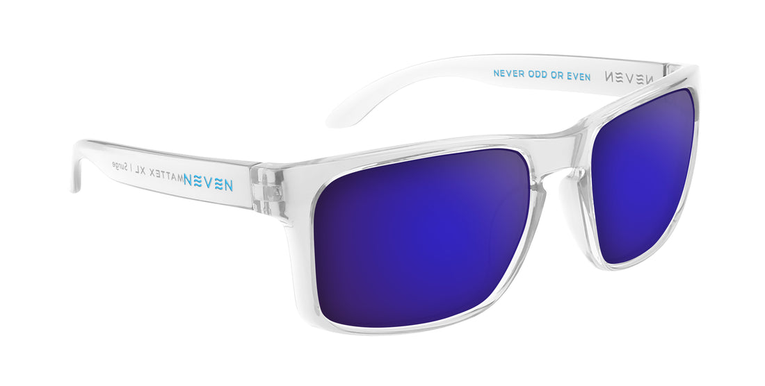 Three-quarter view of Surge XL prescription sunglasses showcasing clear glossy frames and purple mirrored lenses on white background