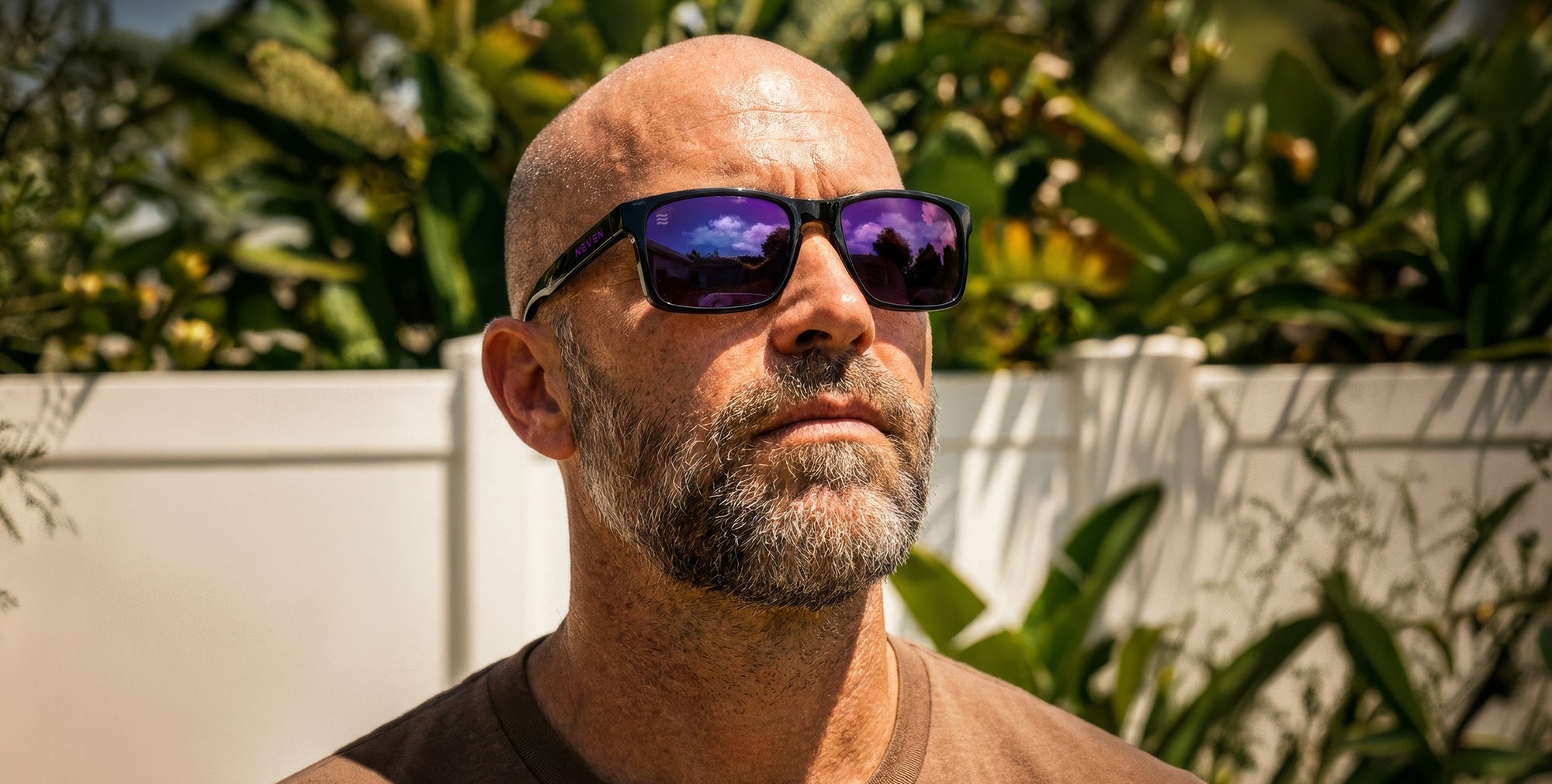 Man wearing sunglasses with a blurred natural background
