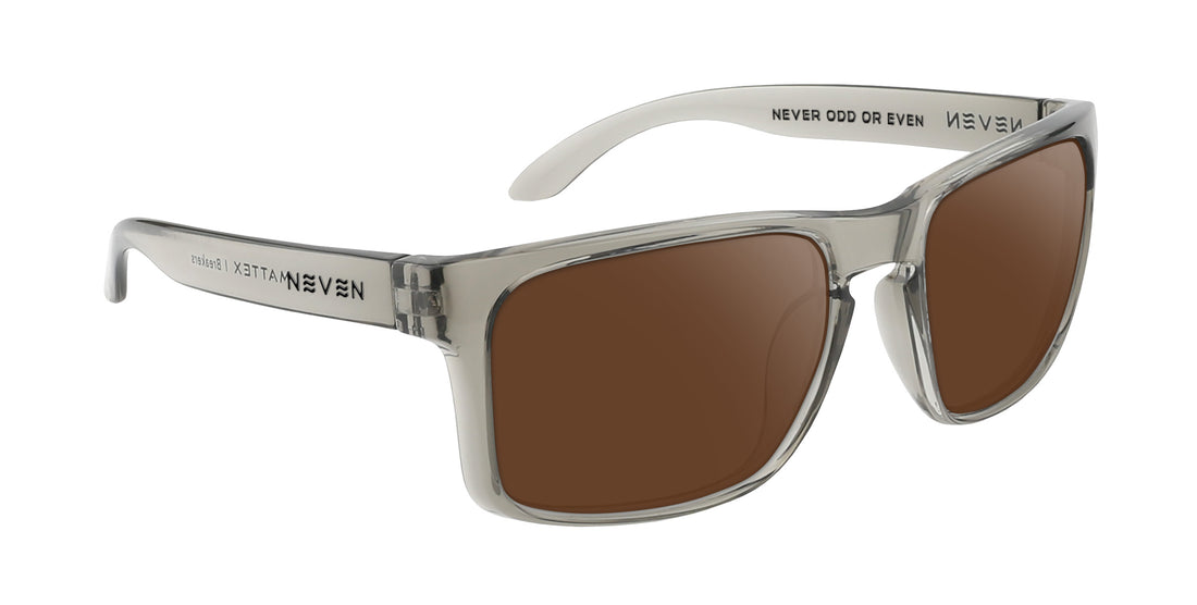 Three-quarter view of Breakers prescription sunglasses showing transparent gray rectangular frame and brown lenses on white background