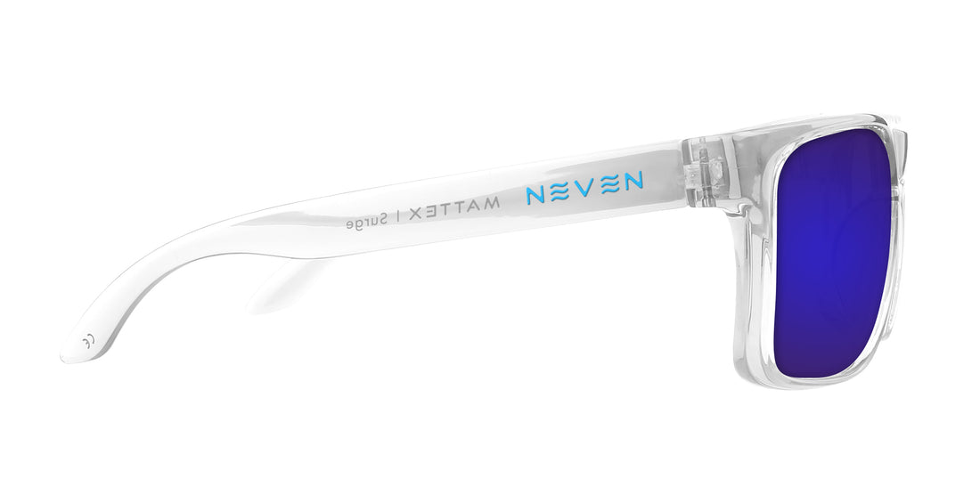 Side view of Surge XL prescription sunglasses showcasing clear glossy frame and purple mirrored lens on white background
