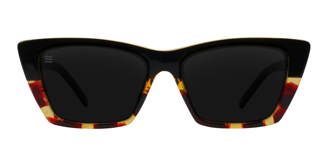 Dusk cat-eye sunglasses with a tortoiseshell frame and dark lenses.