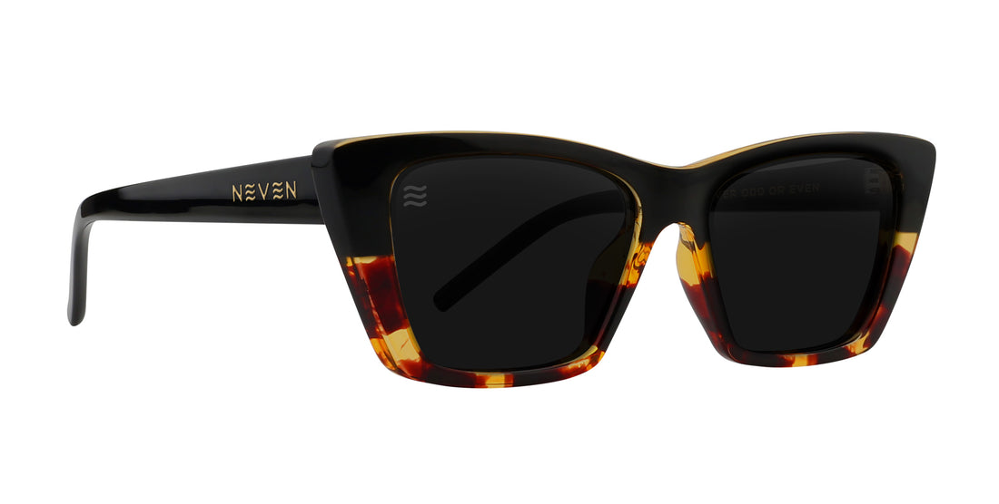 Dusk Tortoise Cat Eye Polarized Sunglasses with dark lenses.