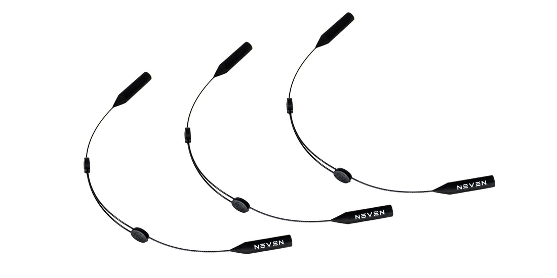 Three Neven Eyewear wire retainers with adjustable lengths and small branded pendants on a white background.
