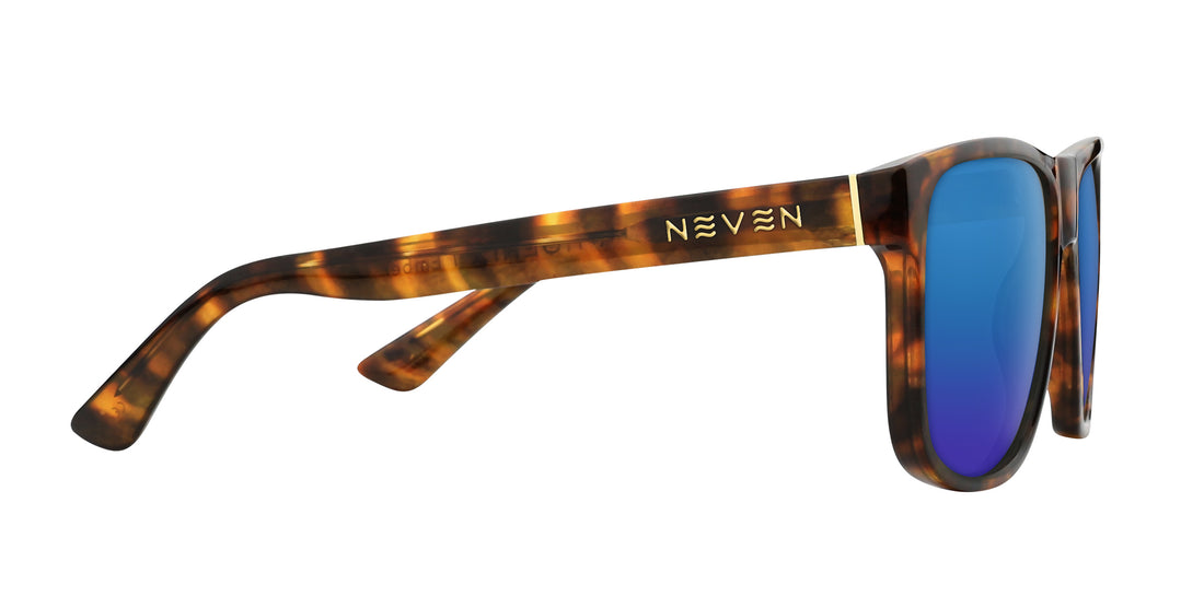 Side view of Ember sunglasses showcasing tortoiseshell frame, gold Neven logo, and blue mirrored lenses on white background