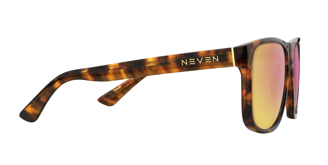Side view of Ember prescription sunglasses showcasing tortoise shell frame, gold Neven logo on the temple, and pink-gold mirrored lenses on white background