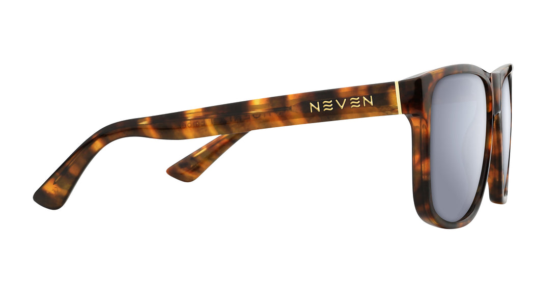 Side view of Ember Rx sunglasses showcasing tortoise shell frame, gold Neven logo, and stainless steel hinge on white