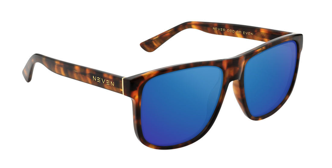 Three-quarter view of Ember prescription sunglasses with tortoise shell frame, blue mirrored lenses, and gold Neven logo