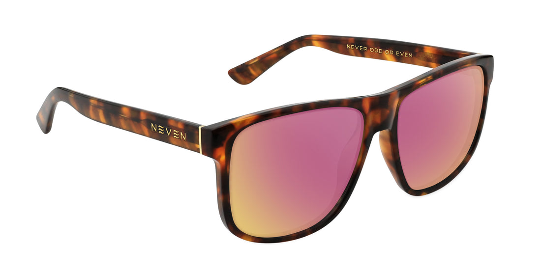 Three-quarter close-up of Ember prescription sunglasses showing tortoise shell frame, pink mirrored lenses and gold logo on white background