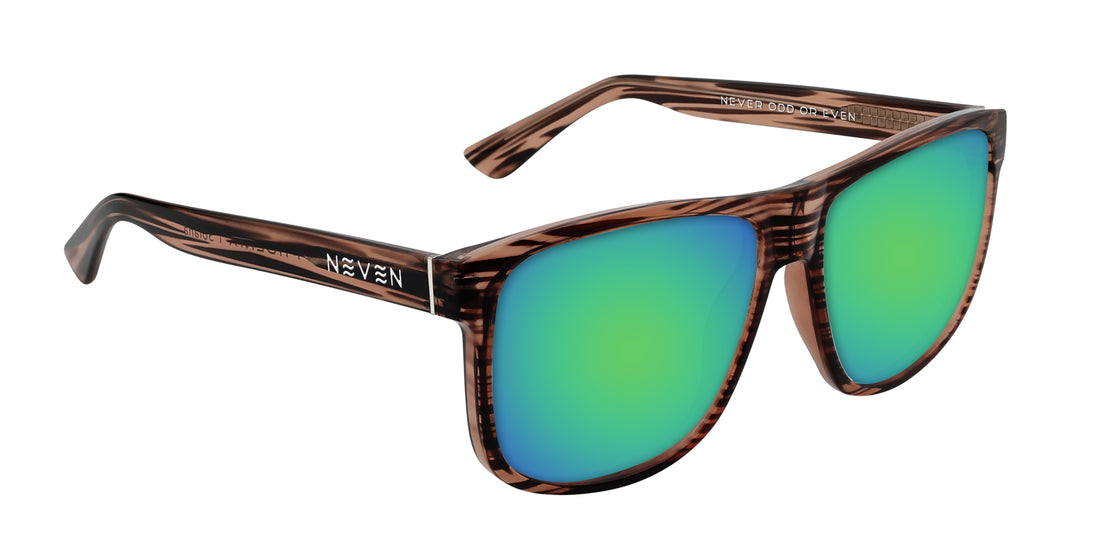 Three-quarter close-up of Solana prescription sunglasses showing transparent wood-grain glossy frame and green mirrored lenses on white background