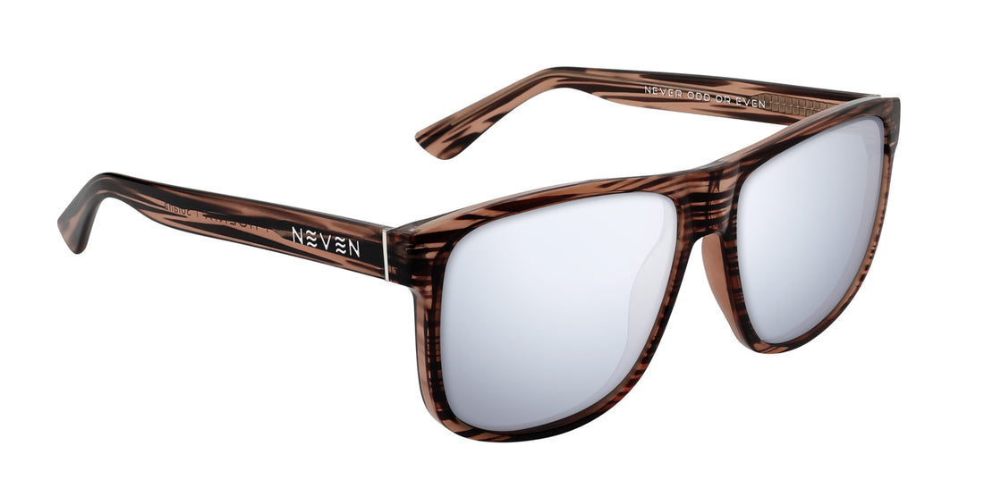 Three-quarter close-up of Solana prescription sunglasses showing wood-grain transparent gloss large frame and silver mirrored prescription lenses on white background