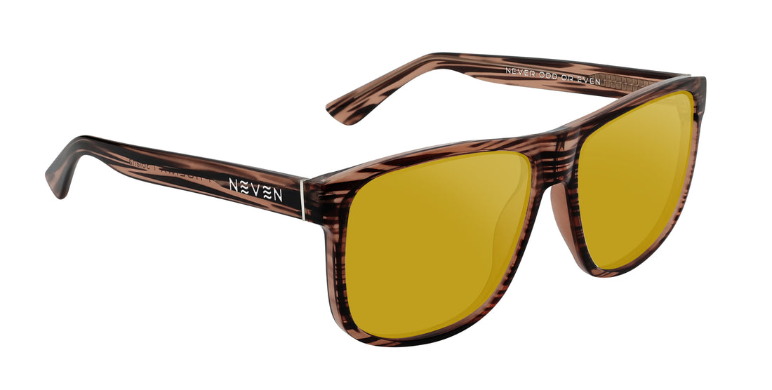 Three-quarter view of Solana Rx sunglasses with transparent wood-grain frame, yellow lenses, NEVEN temple logo on white