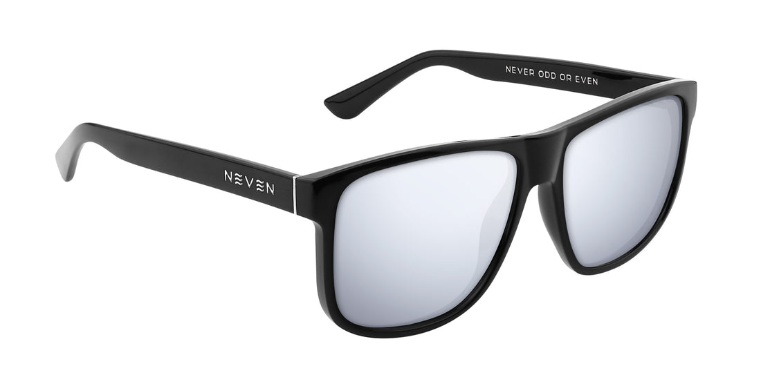 Three-quarter close-up of Triumph RX sunglasses with black frame, silver mirrored lenses and silver hinge on white background