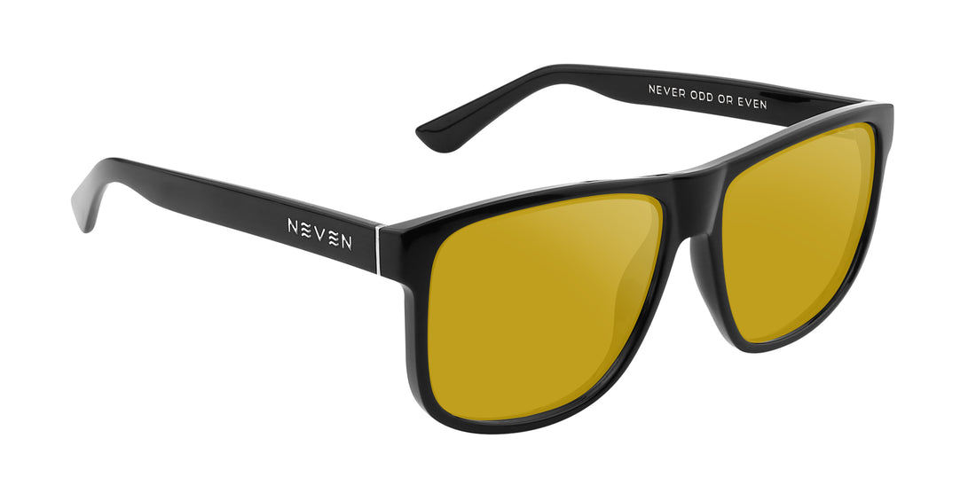 Close-up side view of Triumph Rx prescription sunglasses showcasing glossy black large frame, yellow lenses, Neven logo on white background