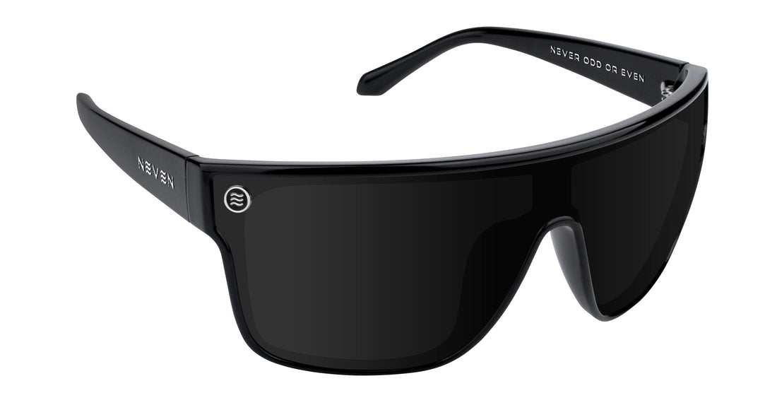 Close-up angled view of Wire sunglasses showcasing gloss black shield lens and NEVEN logo on the temple with white background
