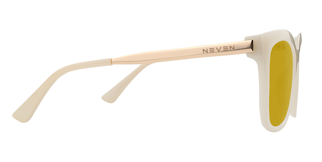Side close up of Sand Dollar sunglasses showing gold temple with NEVEN engraving, greige frame and yellow lens on white