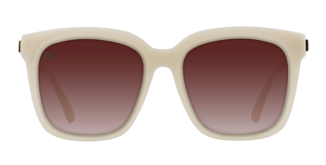 Front view of Sand Dollar sunglasses showcasing a sand square frame and gradient brown lenses on a white background