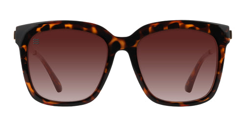 Tortoiseshell sunglasses with brown gradient lenses.