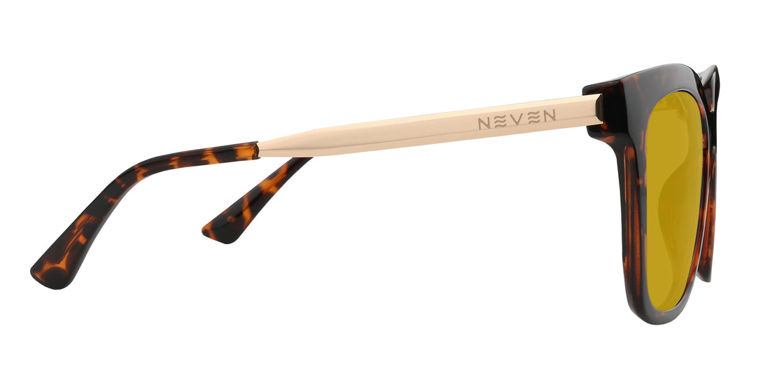 Side view of Sarasota prescription sunglasses showcasing yellow lenses, glossy tortoise frame, and gold metal temples on a white background
