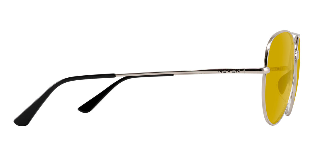 Side view of Shirogane sunglasses showcasing polished silver metal frame and yellow lenses with black temple tips on white background