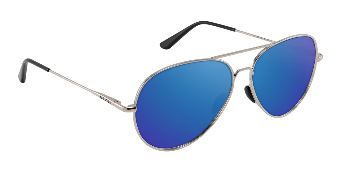 Angled close-up of Shirogane aviator sunglasses showing silver frame and coastal blue mirrored lenses on white background