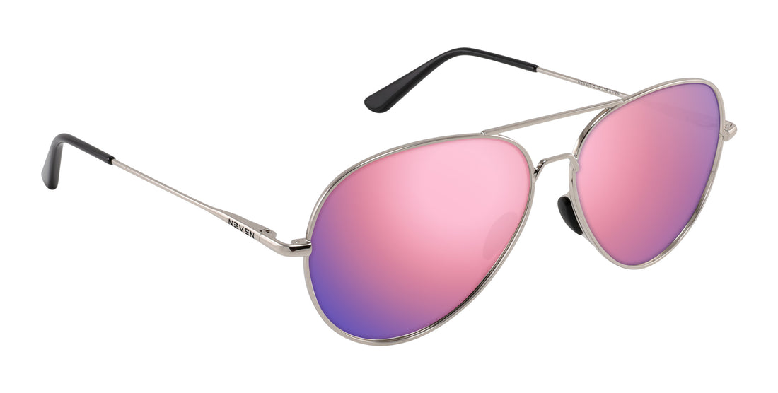Three-quarter view of Shirogane aviator sunglasses showcasing silver metal frame and pink mirrored lenses on white background