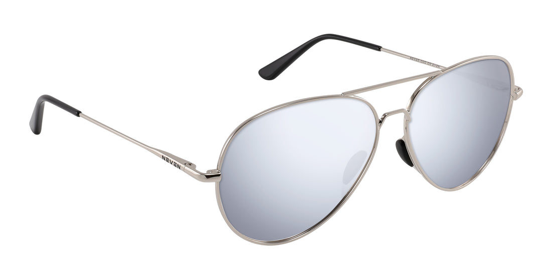 Close-up of Shirogane aviator sunglasses with silver metal frames, embedded nose pads, mirrored lenses, white background