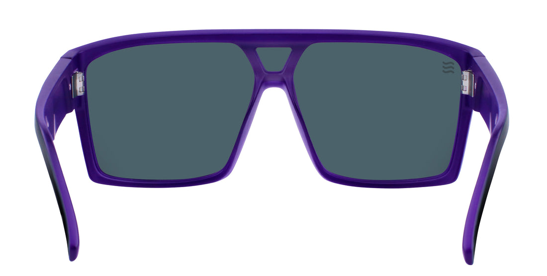 Front close-up of Paradise sunglasses with matte purple/black frame and purple polarized lenses on white background
