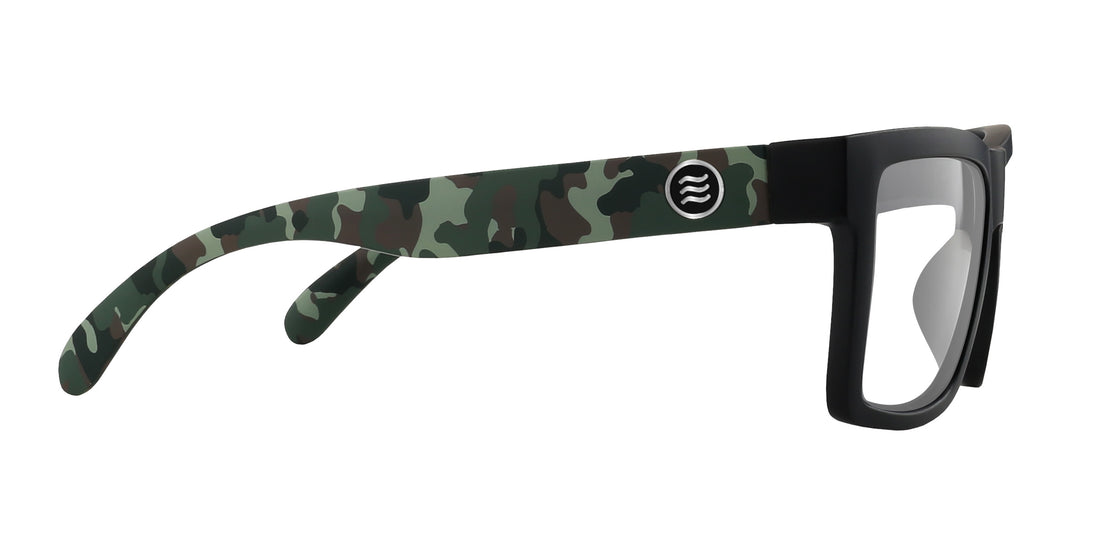 Side view of Bad Company prescription sunglasses showing matte black frame, camo-pattern temples, stainless steel logo and clear lenses on white background