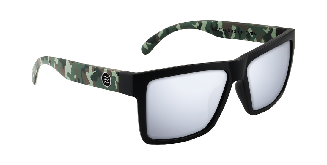 Angled view of Tombstone Bad Company sunglasses with black frame, silver mirrored lenses and camo temples on white background