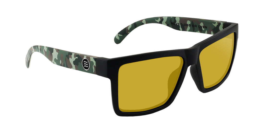 Three-quarter view of Bad Company prescription sunglasses showcasing matte black frame with camo temples and yellow lenses on white background