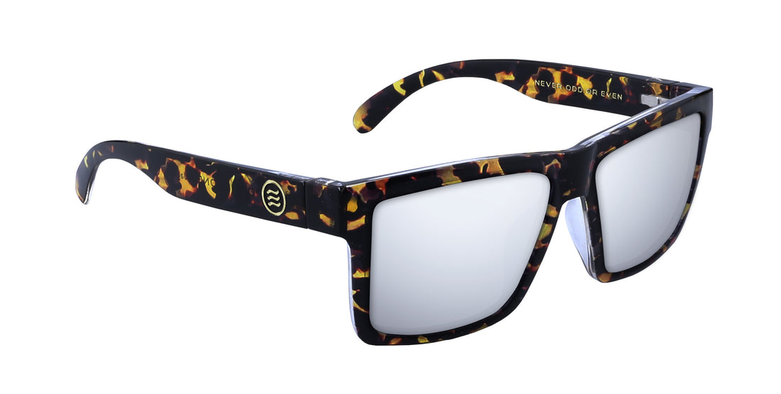 Angled close up of Jaguar sunglasses with gloss tortoise shell frame, flexible stainless hinges and mirrored lenses on white background