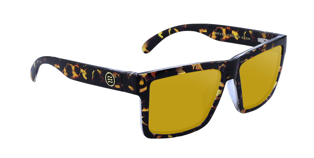 Angled close-up of Jaguar prescription sunglasses showcasing glossy tortoiseshell large frame and yellow prescription lenses on white background