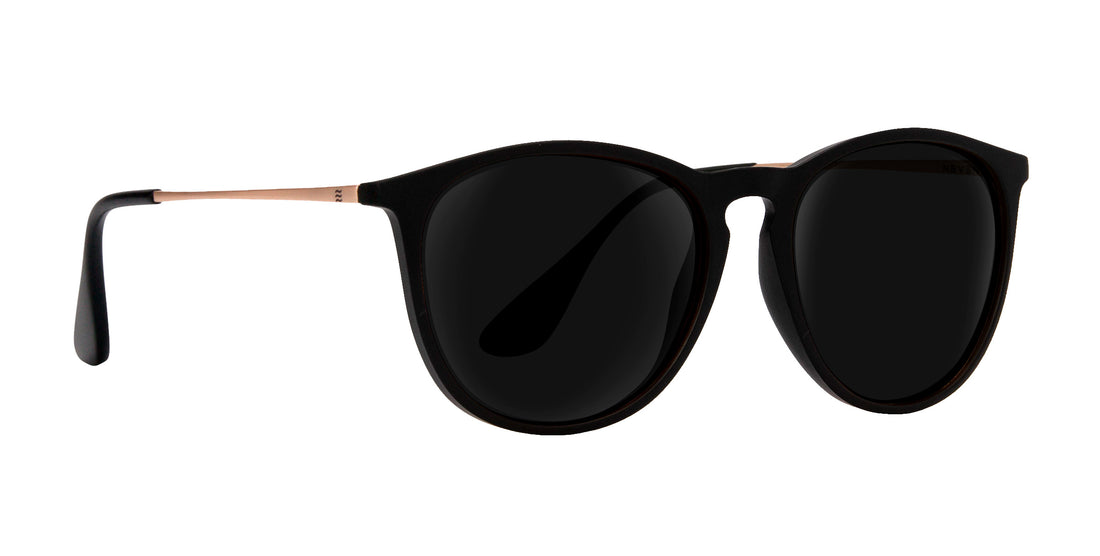 Goldie Lux black round prescription glasses with dark lenses and gold accents.