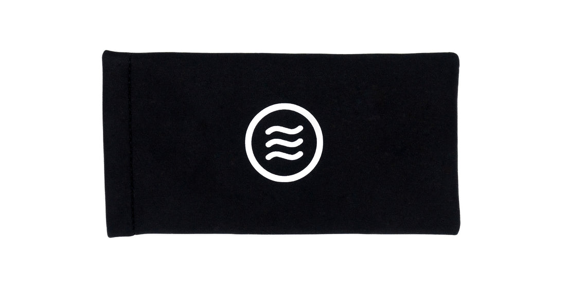 Top-down view of Quick Close Case showcasing the white Neven tilde logo on a black slim quick-close sleeve