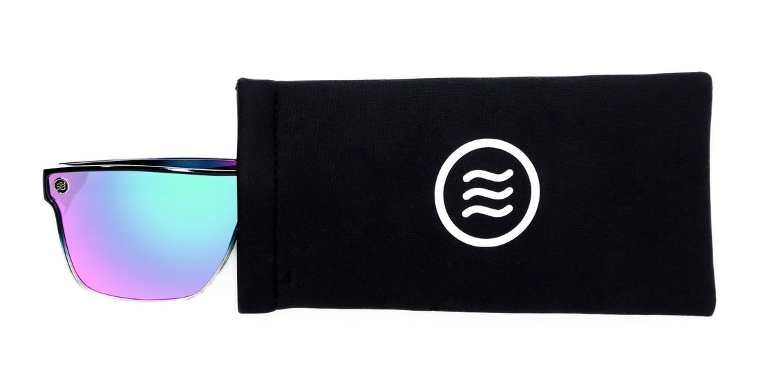 Top view of 3 Pack Quick Close Case showing Neven tilde logo and mirrored sunglasses peeking from left