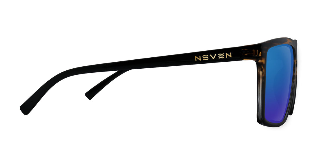Side view of Asbury sunglasses showing gold NEVEN logo on black temple, tortoiseshell frame and blue mirrored lens on white