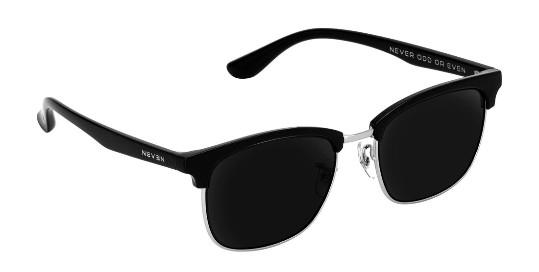 Three-quarter view of Bullet browline prescription sunglasses showcasing black matte brow, silver metal lower rims and black lenses on white background