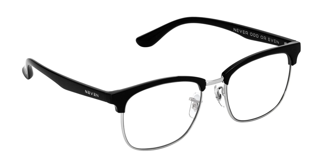 Three-quarter close-up of Bullet browline glasses, black acetate top, silver metal rims and adjustable nose pads on white background