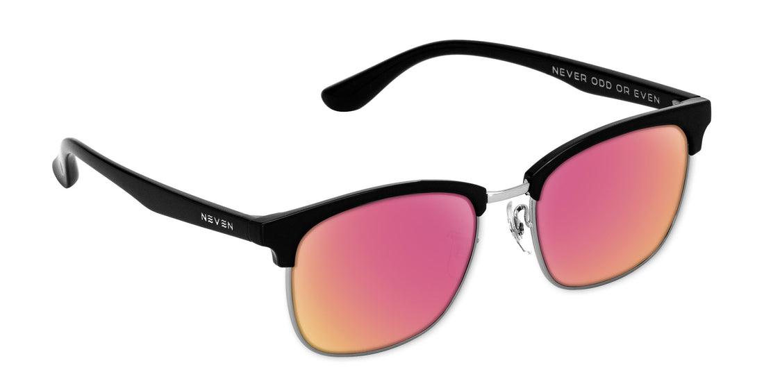 Angled close-up of Bullet prescription sunglasses showing black browline, silver bridge, and rose-pink mirrored lenses on white background