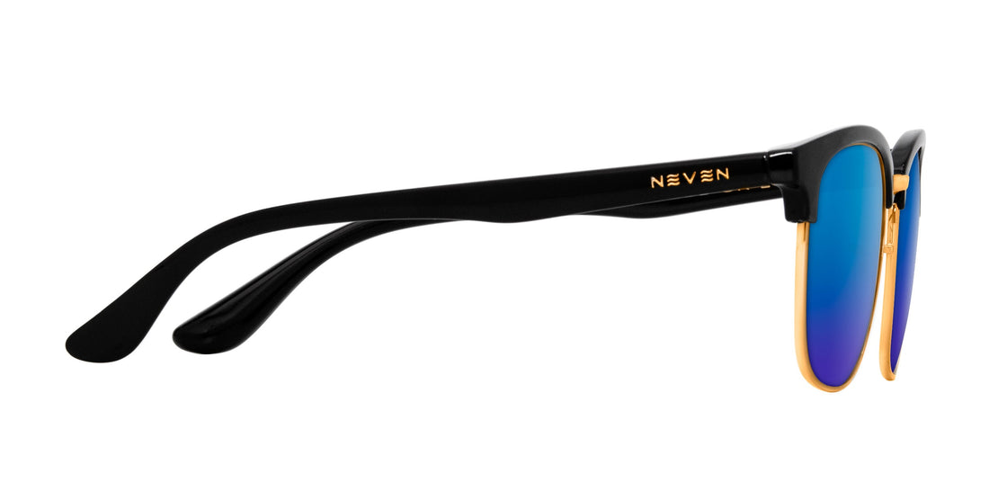 Side close-up of Gold Rush sunglasses showing black temple with gold accents, NEVEN logo, and blue mirrored lenses on white background